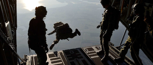 An image of a Canadian Armed Forces (CAF) member who is about to jump from an airplane.